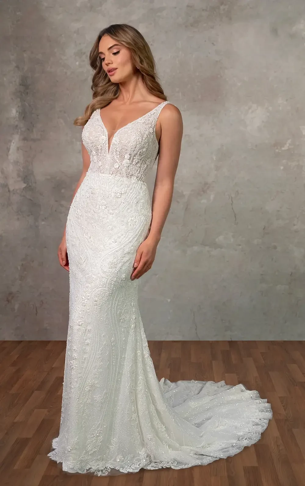 model is wearing a sleeveless column bridal gown